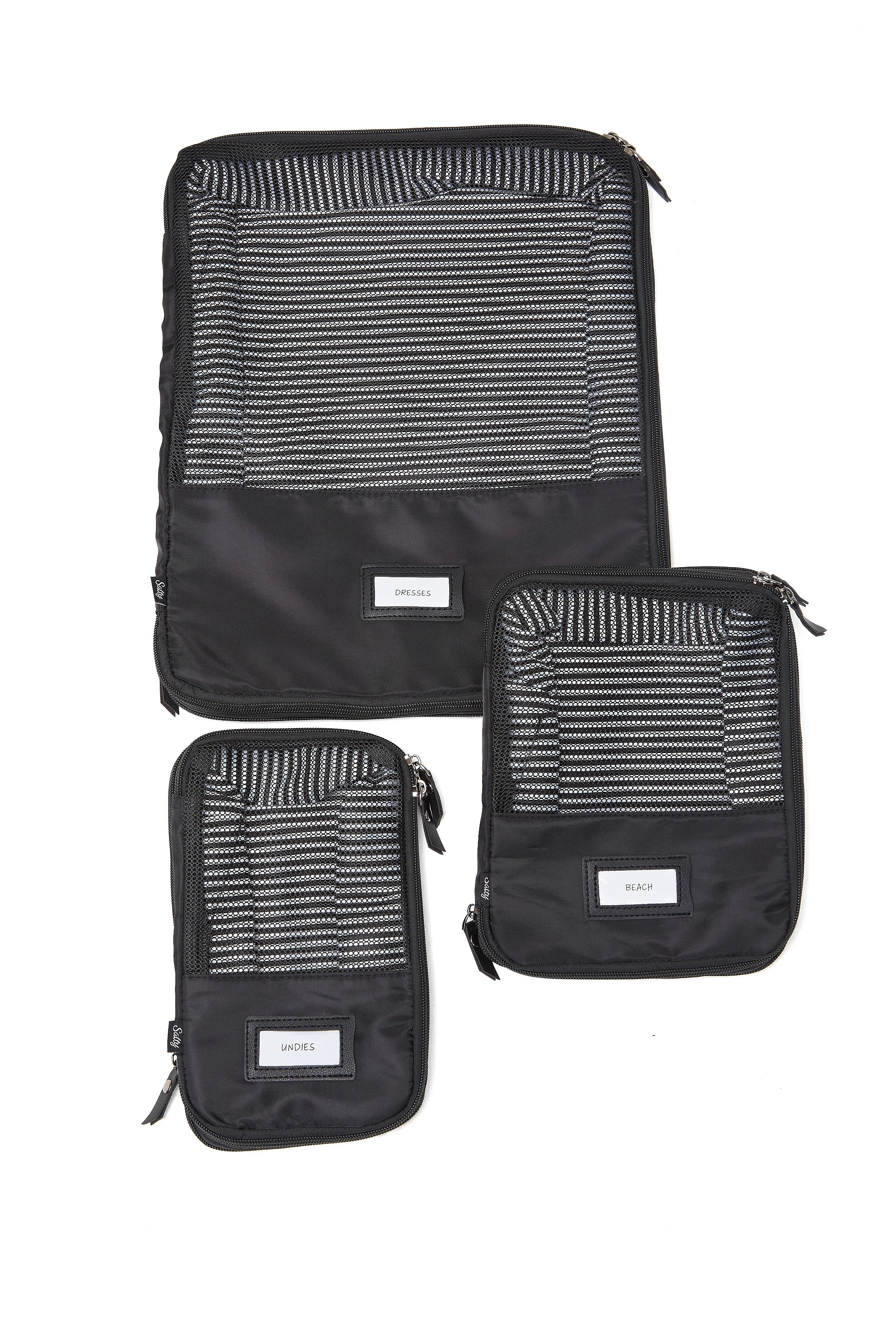 Set of black travel cubes designed for suitcase organisation