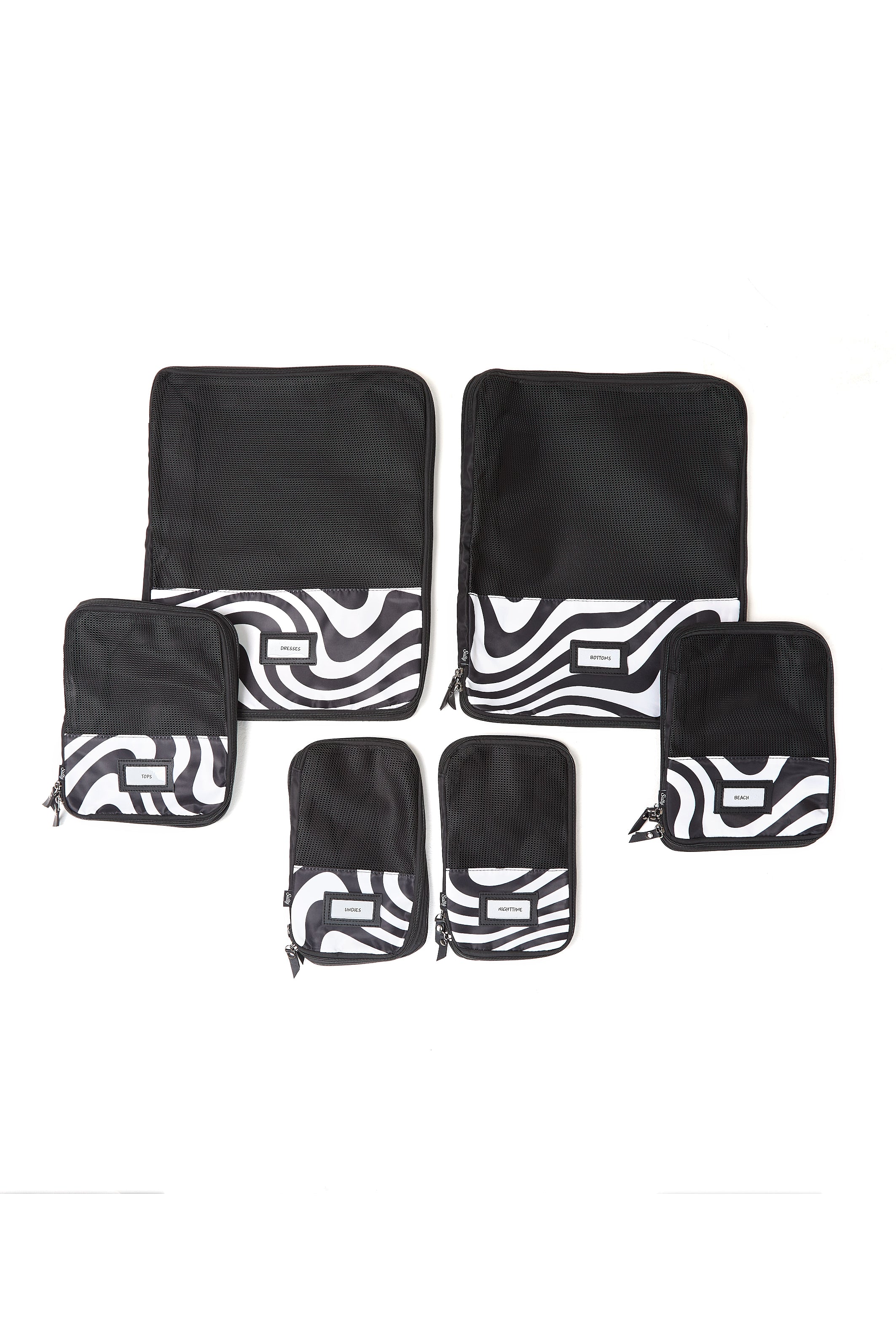 Set of black compression packing cubes for travel organisation